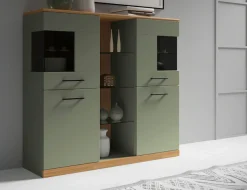 OTTO home Highboard »Ribe,120cm breit,112cm hoch,Oberplatte massiv,12 Fächer« Eiche massiv,Melamin Salbeigrün,schwarze Metall Griffe,Türen mit Glass