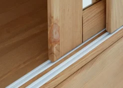OTTO home Schiebetürenschrank »Konrad, Landhausstil, rustikal, mit Schubladen + Spiegel, Kassetten« massive Kiefer, FSC®-zertifiziert, Messinggriffe